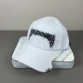 White cotton cap with black graphic embroidery and sculpted brim