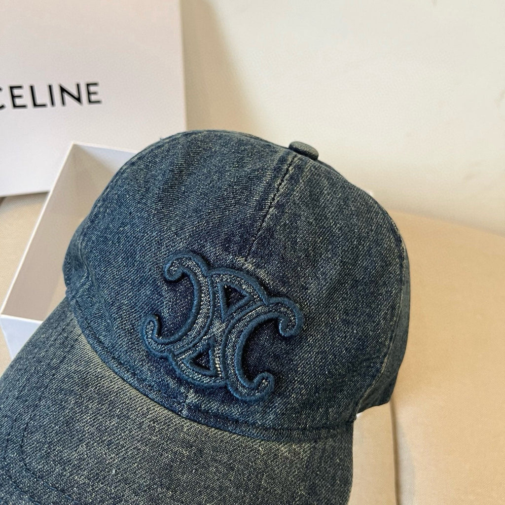 Washed blue denim cap with tonal emblem and gold buckle