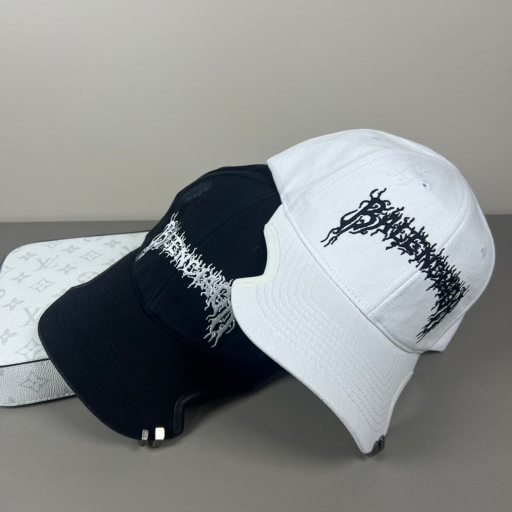 White cotton cap with black graphic embroidery and sculpted brim