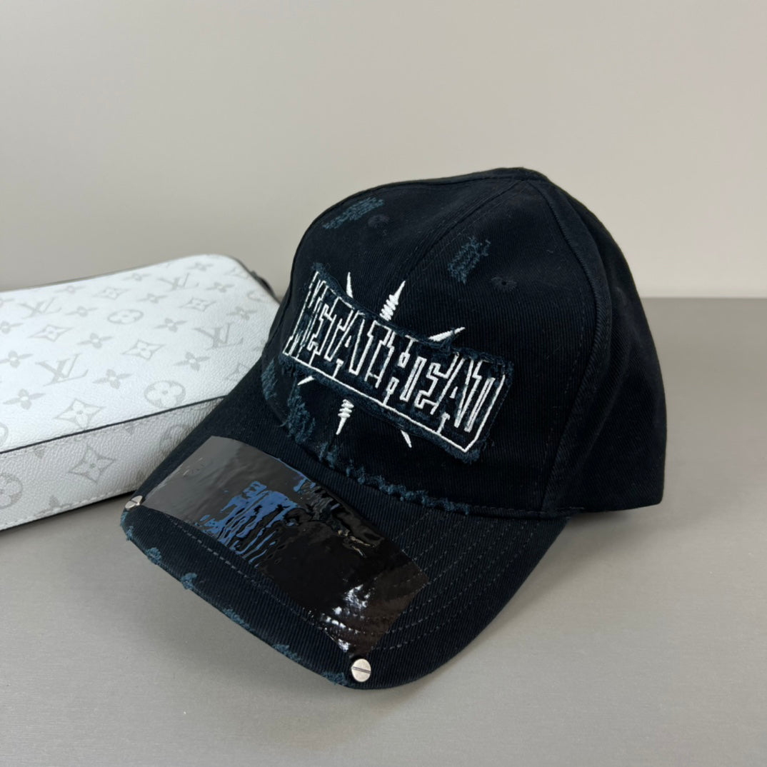 Black distressed cotton cap with metal graphic and glossy shield brim