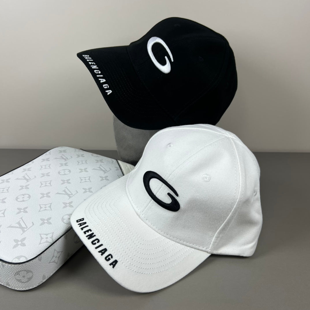 Black cotton cap with white oval emblem embroidery